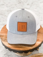 PITTSFORD MRKT LEATHER PATCH TRUCKER HAT